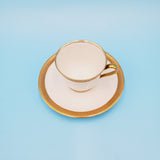 White and Gold Demitasse Teacup and Saucer by C. Ahrenfeldt Limoges - France Depost